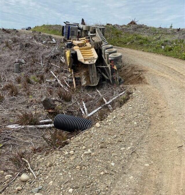 Grinder Overturned on a Logging Road