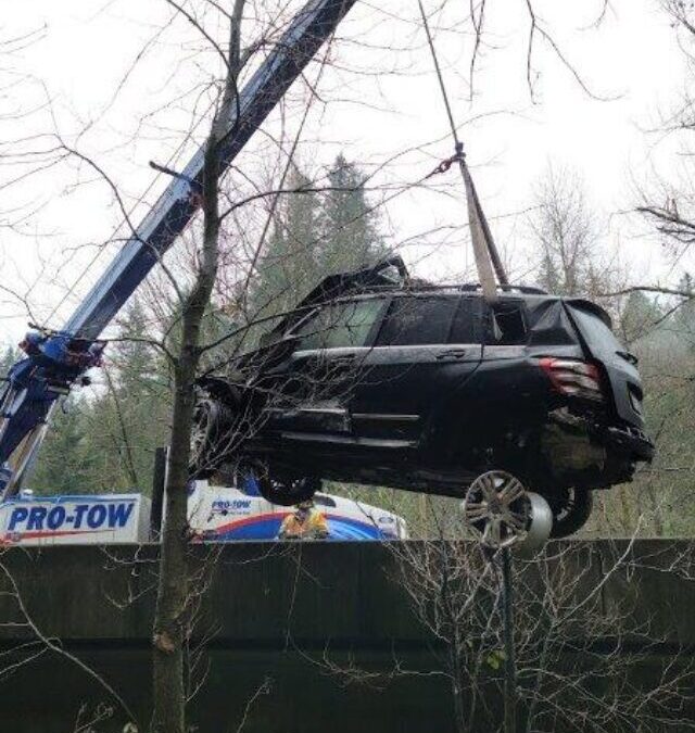 Up, Over and Out: Crane Lifting a Car