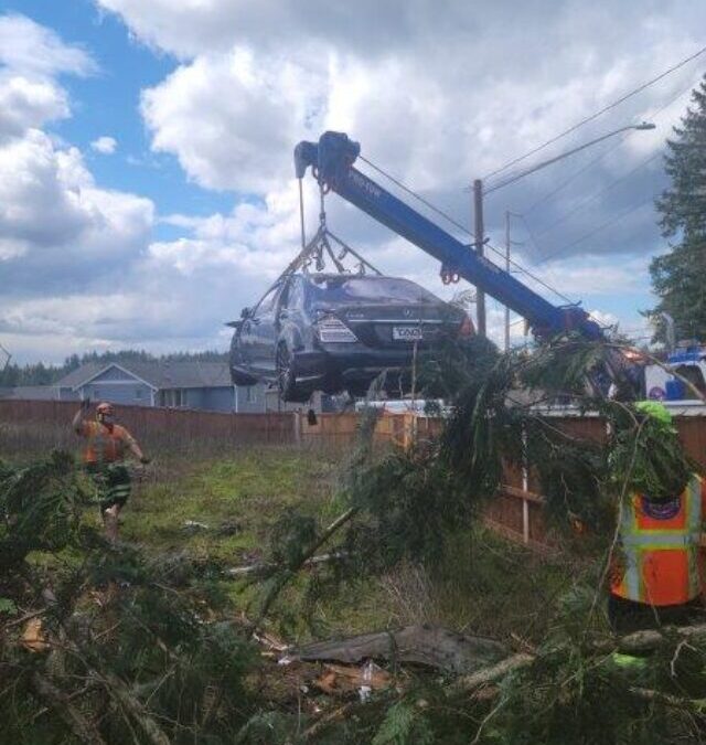 Lifting a Benz Over a Fence