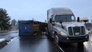 Flipped container needs heavy-duty recovery in Spokane.