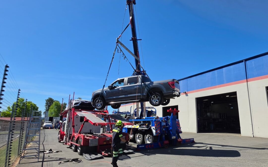 Unloading a car hauler in Auburn