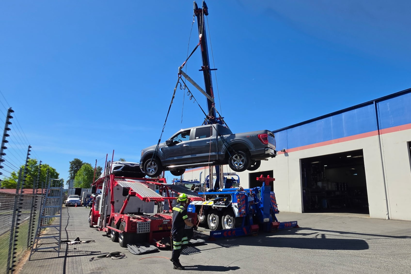 Unloading a car hauler in Auburn